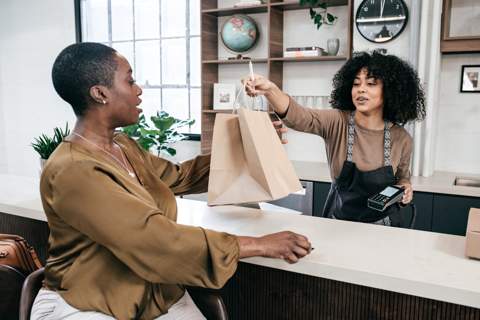 Happy customer in small retail store