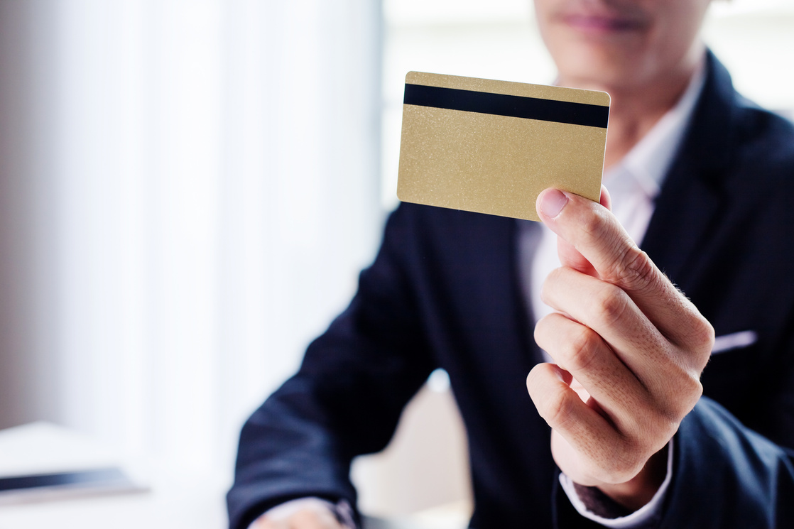 Businessman Holding Gold Credit Card.